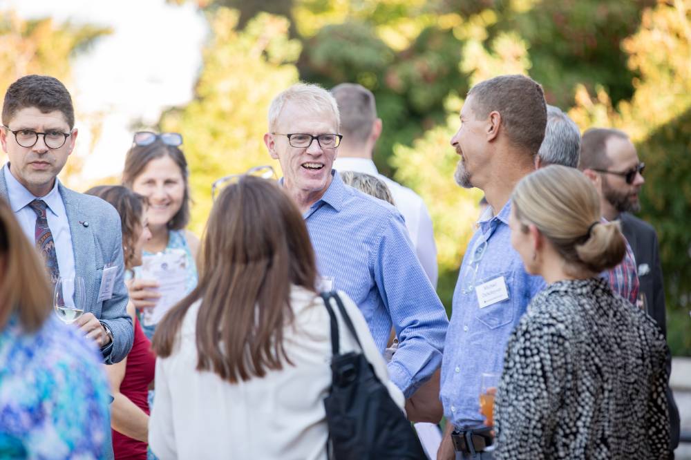 faculty chatting outside